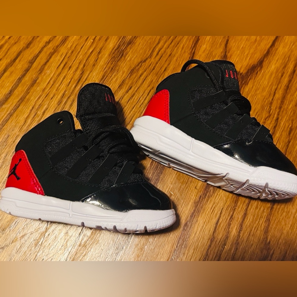 Air Jordan Black and Red Infant Athletic Shoes
Size 5C